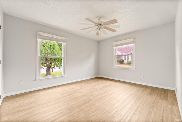 722 Biscayne Ave, Warsaw, IN 46580 - empty room with healthy amount of natural light, wood finished floors, ceiling fan, and baseboards