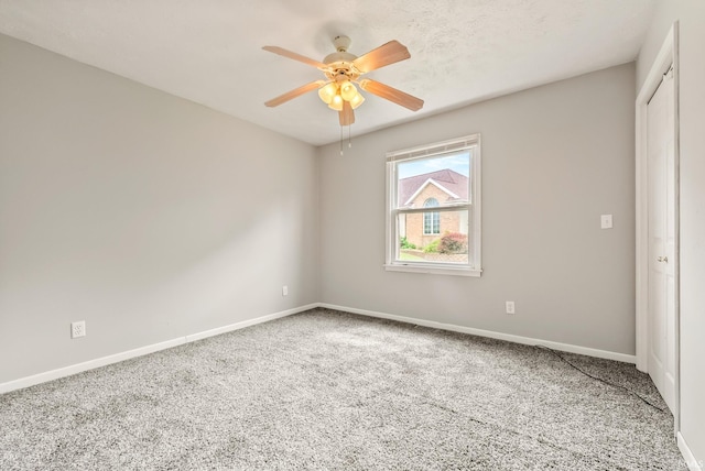 722 Biscayne Ave, Warsaw, IN 46580 - empty room featuring carpet floors, baseboards, and ceiling fan