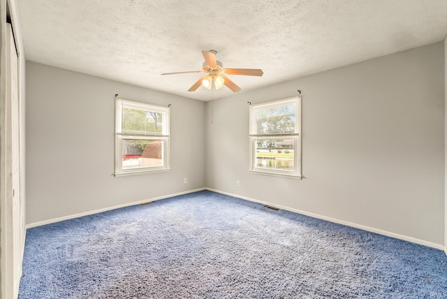 722 Biscayne Ave, Warsaw, IN 46580 - carpeted spare room with a ceiling fan, baseboards, and a textured ceiling