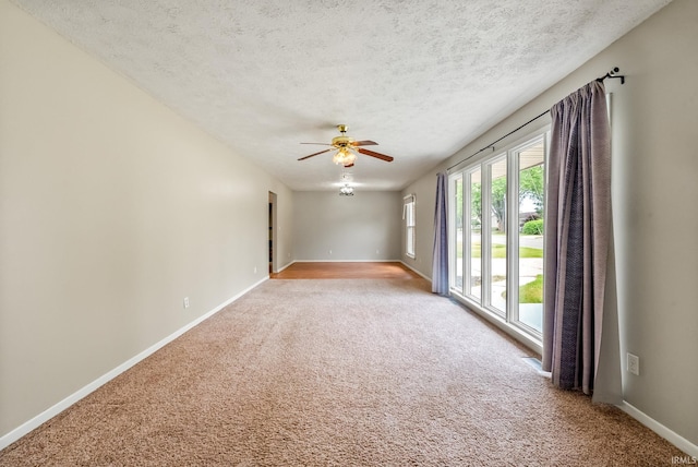 722 Biscayne Ave, Warsaw, IN 46580 - empty room featuring light colored carpet, baseboards, a textured ceiling, and ceiling fan