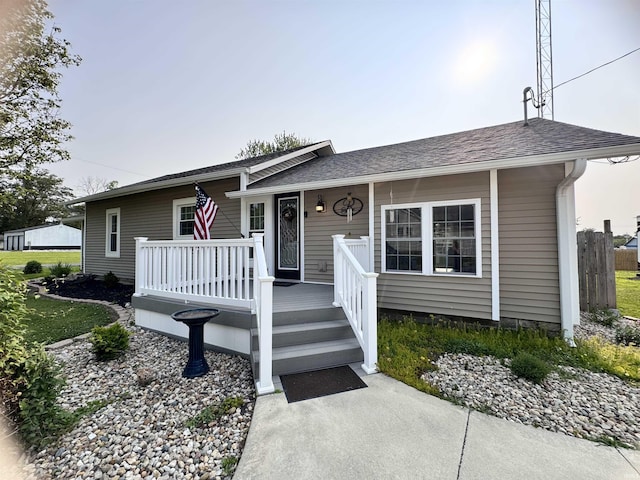 138 Esmeralda St, Olney, IL 62450 - ranch-style house with covered porch and roof with shingles