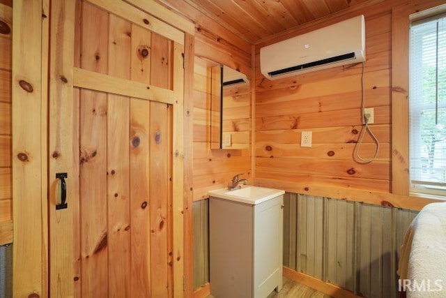 0 Creekview Ln, Cannelton, IN 47520 - laundry area featuring a wall mounted air conditioner, wooden walls, wood ceiling, and a sink