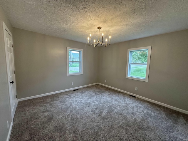 360 NE C St, Linton, IN 47441 - spare room featuring a chandelier, baseboards, carpet, and a textured ceiling