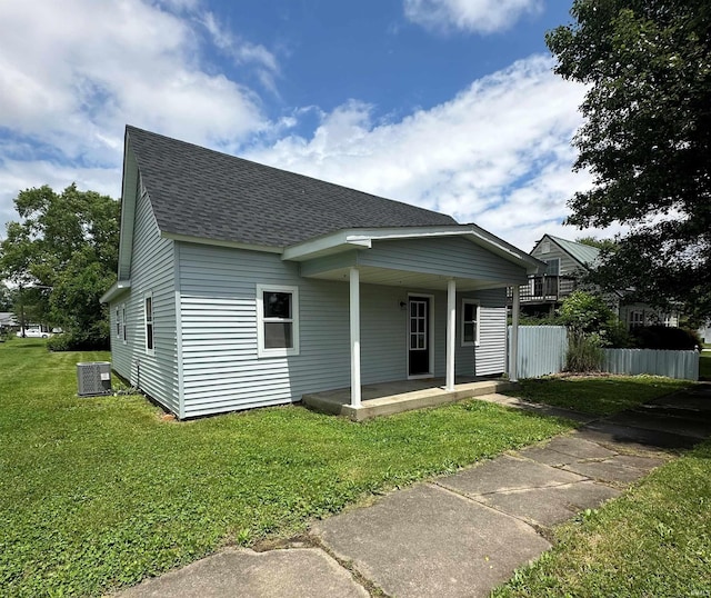 360 NE C St, Linton, IN 47441 - view of front of house with a shingled roof, a porch, and central AC unit