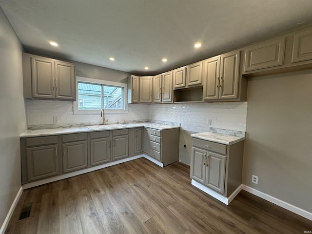 360 NE C St, Linton, IN 47441 - kitchen featuring a sink, gray cabinetry, dark wood-style flooring, baseboards, and recessed lighting