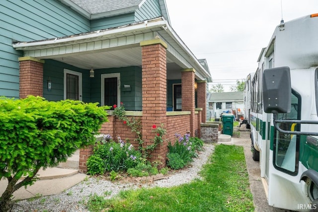1226 Kinyon St, South Bend, IN 46616 - view of property exterior with brick siding and covered porch
