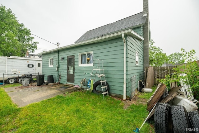 1226 Kinyon St, South Bend, IN 46616 - back of house with a patio area and a chimney