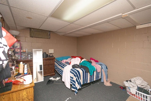 1310 Sinton Ave, Lafayette, IN 47905 - bedroom with concrete block wall, carpet floors, and a drop ceiling
