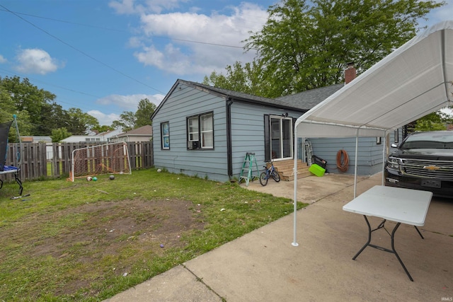 1310 Sinton Ave, Lafayette, IN 47905 - view of side of property featuring entry steps, a detached carport, and a shingled roof