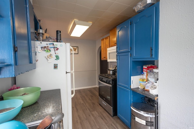 1310 Sinton Ave, Lafayette, IN 47905 - kitchen with white appliances, blue cabinets, wood finished floors, and arched walkways