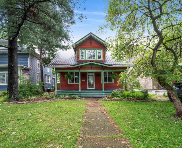 336 Arcadia Ct, Fort Wayne, IN 46807 - view of front of property with covered porch, a front yard, and metal roof