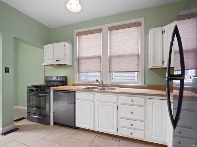 336 Arcadia Ct, Fort Wayne, IN 46807 - kitchen with stainless steel appliances, a sink, white cabinetry, and light tile patterned floors