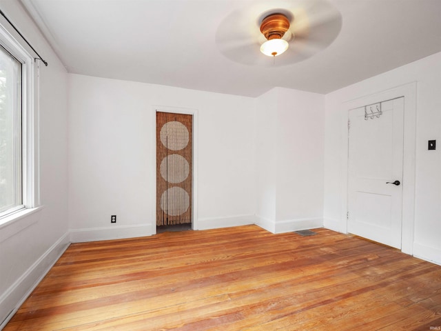 336 Arcadia Ct, Fort Wayne, IN 46807 - empty room with a ceiling fan, light wood-style flooring, and baseboards