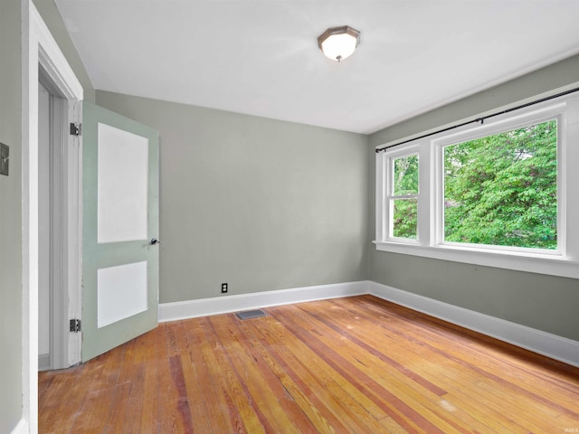 336 Arcadia Ct, Fort Wayne, IN 46807 - empty room featuring baseboards and hardwood / wood-style floors