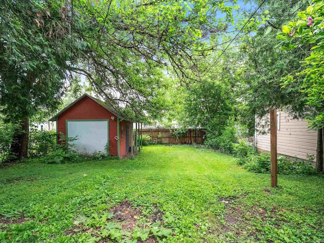 336 Arcadia Ct, Fort Wayne, IN 46807 - view of yard featuring a detached garage and an outdoor structure