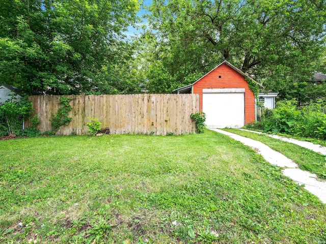 336 Arcadia Ct, Fort Wayne, IN 46807 - view of yard featuring an outbuilding, a garage, and driveway