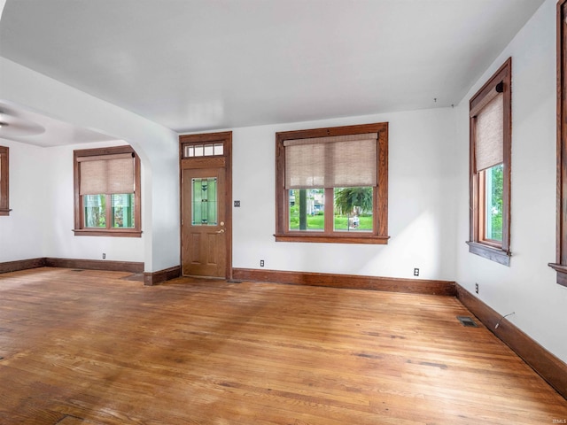 336 Arcadia Ct, Fort Wayne, IN 46807 - entrance foyer with plenty of natural light, wood finished floors, arched walkways, and baseboards