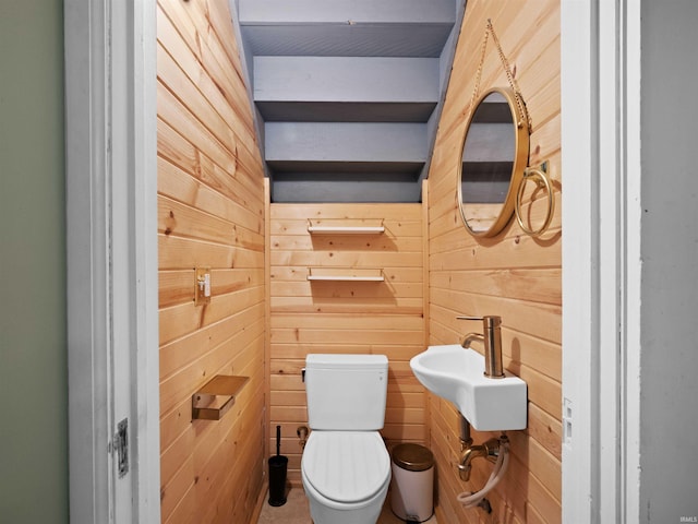 336 Arcadia Ct, Fort Wayne, IN 46807 - bathroom featuring wood walls, toilet, and a sink