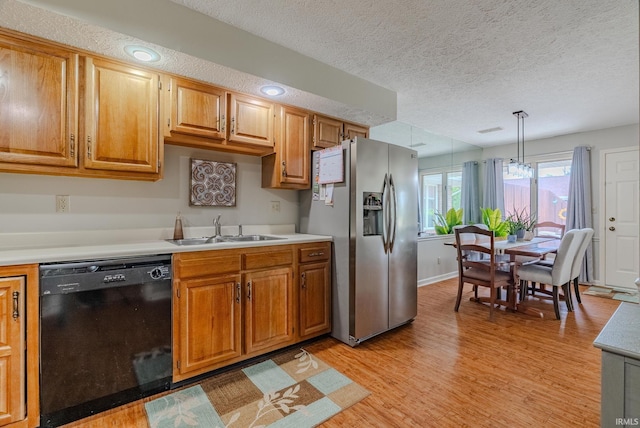 4635 S Bellamy Blvd, Marion, IN 46953 - kitchen featuring black dishwasher, stainless steel fridge with ice dispenser, light countertops, light wood-type flooring, and a textured ceiling