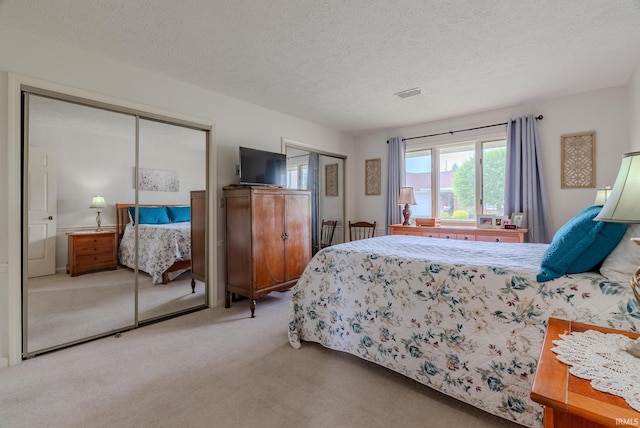 4635 S Bellamy Blvd, Marion, IN 46953 - bedroom featuring carpet, multiple closets, and a textured ceiling