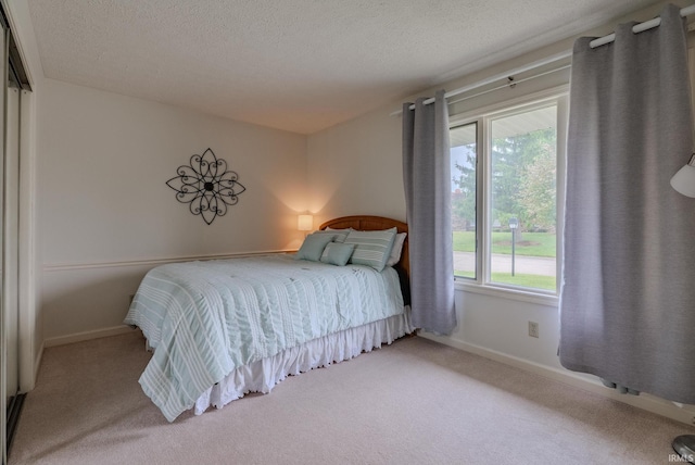 4635 S Bellamy Blvd, Marion, IN 46953 - carpeted bedroom with multiple windows and a textured ceiling