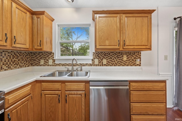 3316 Ingram Ct, Lafayette, IN 47906 - kitchen with stainless steel dishwasher, a sink, light countertops, tasteful backsplash, and brown cabinets