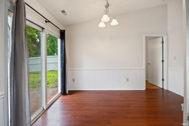 3316 Ingram Ct, Lafayette, IN 47906 - spare room featuring wainscoting, wood finished floors, a chandelier, and vaulted ceiling