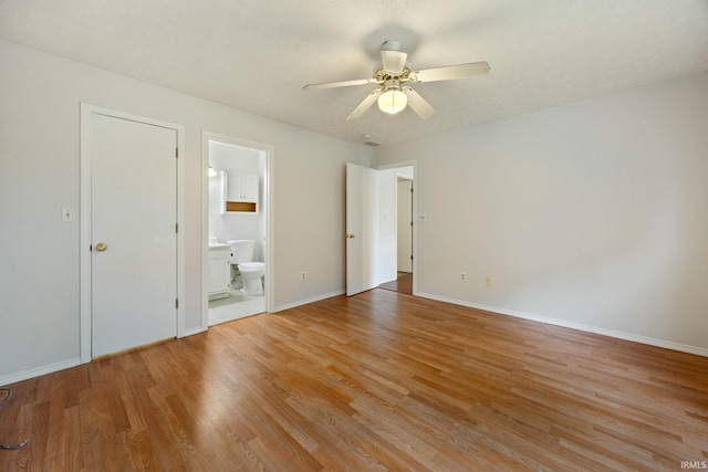 3316 Ingram Ct, Lafayette, IN 47906 - unfurnished bedroom with light wood-style flooring, baseboards, ensuite bath, and a ceiling fan