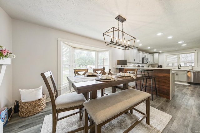 409 E Strain St, Fort Branch, IN 47648 - dining room featuring recessed lighting, wood finished floors, a chandelier, and a textured ceiling