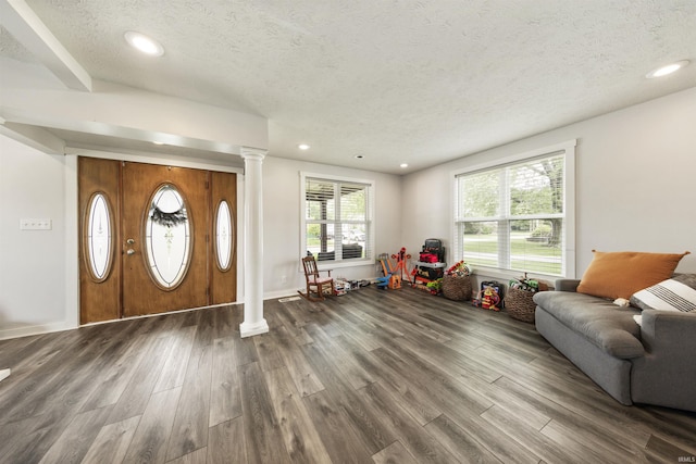 409 E Strain St, Fort Branch, IN 47648 - entryway with dark wood-type flooring, plenty of natural light, a textured ceiling, ornate columns, and recessed lighting