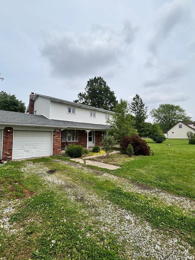 5800 W 100 N Rd, Tipton, IN 46072 - traditional home with brick siding, driveway, a front lawn, a chimney, and a garage