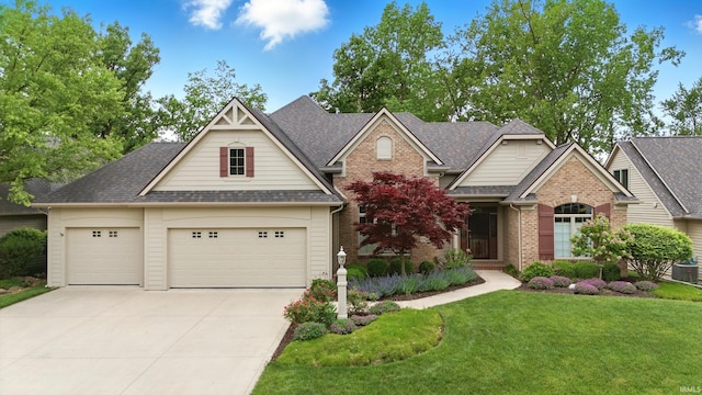15821 Winterberry Ct, Huntertown, IN 46748 - view of front facade with concrete driveway, a front lawn, an attached garage, brick siding, and roof with shingles