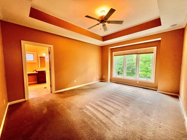 15821 Winterberry Ct, Huntertown, IN 46748 - unfurnished room with a raised ceiling, carpet floors, baseboards, a ceiling fan, and a textured ceiling