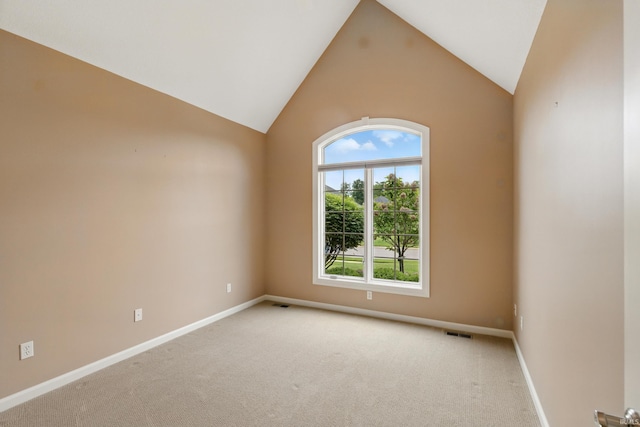 15821 Winterberry Ct, Huntertown, IN 46748 - spare room with light carpet, vaulted ceiling, and baseboards