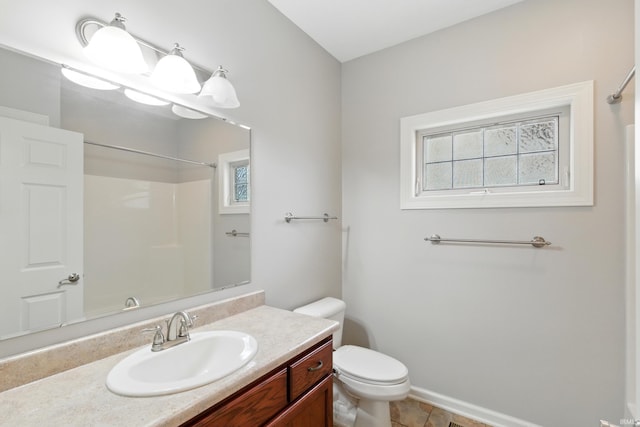 15821 Winterberry Ct, Huntertown, IN 46748 - bathroom featuring a shower, vanity, toilet, baseboards, and tile patterned flooring