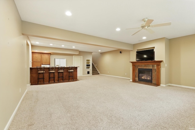 15821 Winterberry Ct, Huntertown, IN 46748 - unfurnished living room featuring recessed lighting, stairway, baseboards, ceiling fan, and light carpet