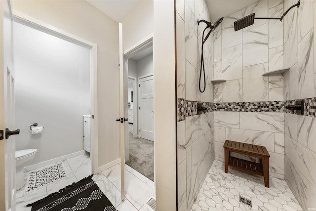 1215 Ladbrooke Dr, Evansville, IN 47725 - bathroom with tiled shower, toilet, marble finish flooring, and baseboards
