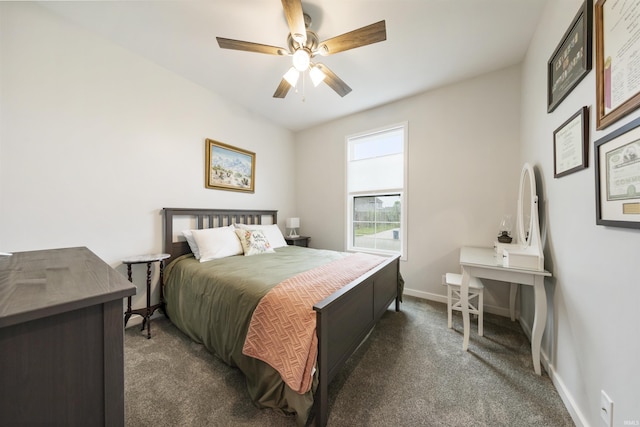 1215 Ladbrooke Dr, Evansville, IN 47725 - bedroom with dark colored carpet, baseboards, and a ceiling fan