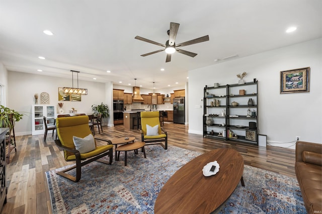 1215 Ladbrooke Dr, Evansville, IN 47725 - living room with recessed lighting, wood finished floors, a ceiling fan, and baseboards