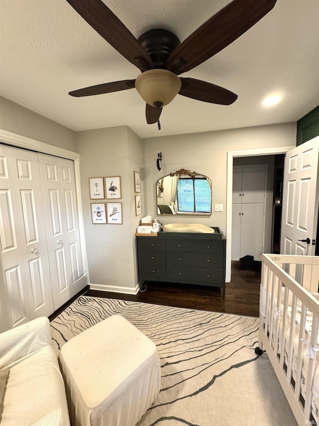 1741 Rockne Dr, South Bend, IN 46617 - bedroom with dark wood-style floors, a closet, and a ceiling fan