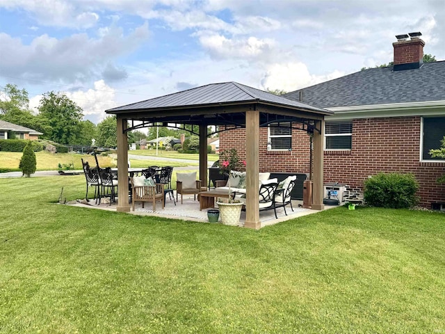 1741 Rockne Dr, South Bend, IN 46617 - back of house with a gazebo, an outdoor living space, brick siding, a yard, and a chimney
