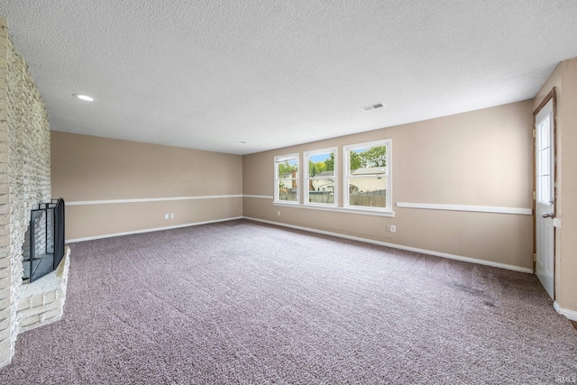 6320 Wakopa Ct, Fort Wayne, IN 46815 - unfurnished room featuring carpet flooring, a textured ceiling, a fireplace, and baseboards