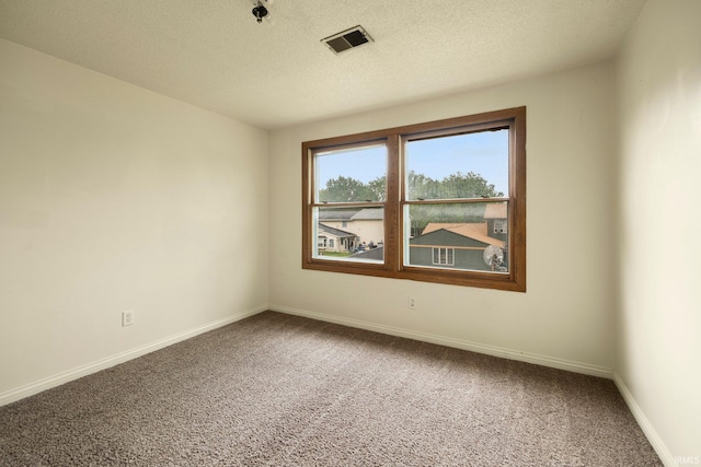 6320 Wakopa Ct, Fort Wayne, IN 46815 - empty room with carpet flooring, baseboards, and a textured ceiling
