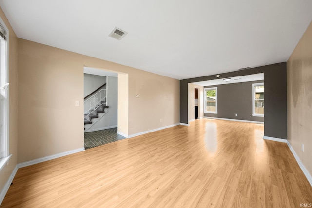 6320 Wakopa Ct, Fort Wayne, IN 46815 - unfurnished room featuring light wood finished floors, stairs, and baseboards