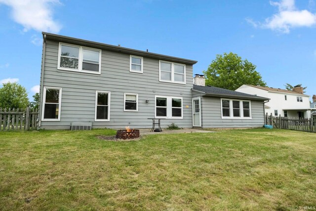 6320 Wakopa Ct, Fort Wayne, IN 46815 - back of house featuring an outdoor fire pit and a chimney