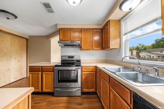 6320 Wakopa Ct, Fort Wayne, IN 46815 - kitchen featuring stainless steel range with electric stovetop, a sink, under cabinet range hood, black dishwasher, and light countertops