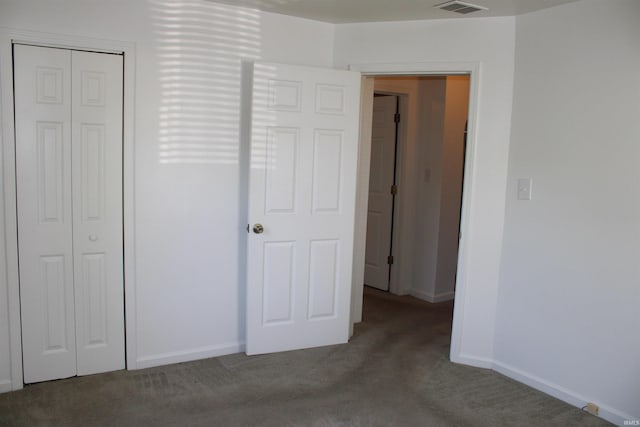 104 Tulip Ave, Evansville, IN 47711 - unfurnished bedroom featuring carpet floors, baseboards, and a closet