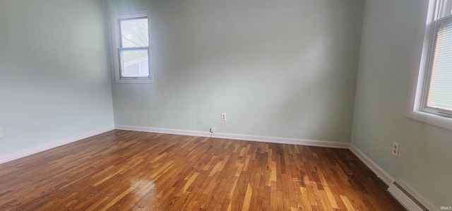 2703 Bosworth Dr, Fort Wayne, IN 46805 - spare room with a baseboard radiator, hardwood / wood-style flooring, and baseboards