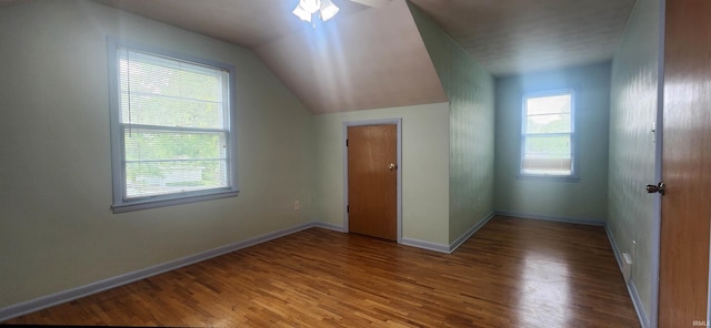 2703 Bosworth Dr, Fort Wayne, IN 46805 - bonus room featuring wood finished floors, baseboards, and vaulted ceiling