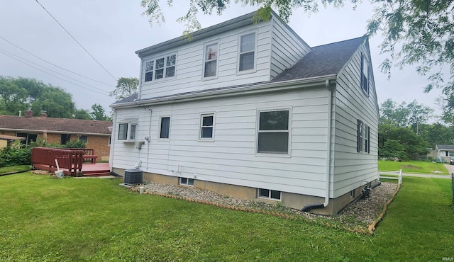 2703 Bosworth Dr, Fort Wayne, IN 46805 - back of house featuring a lawn, a wooden deck, and central AC unit